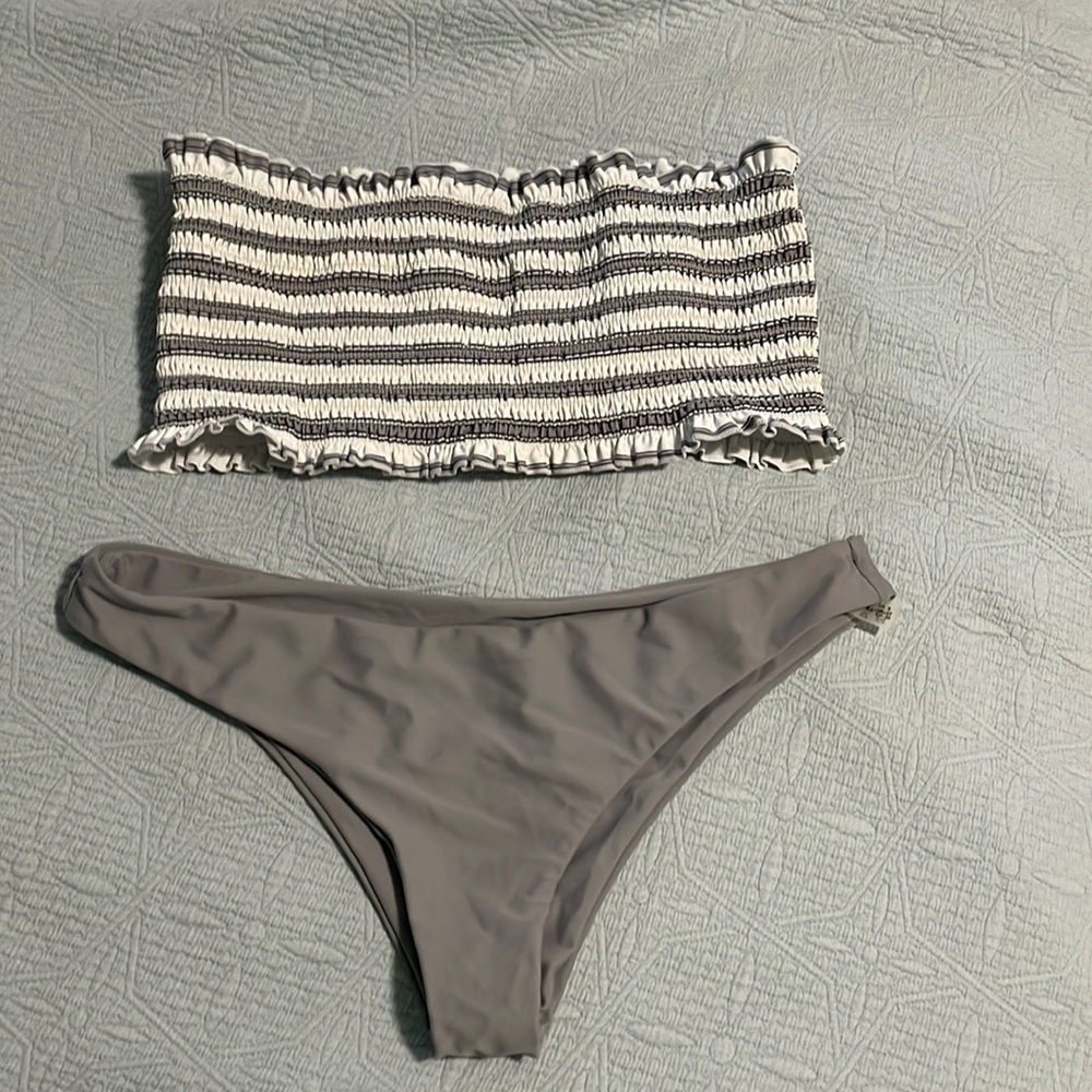 Cute soft gray swimsuit never worn bottoms too cheekini for me.